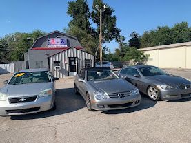 AnZ Automotive lot, vehicles parked near the shop